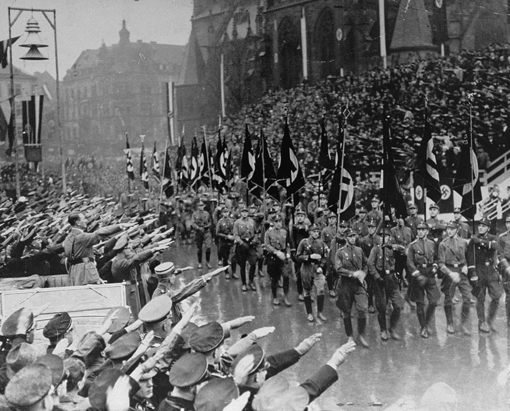 Adolf Hitler reviews SA troops during a parade in front of the town hall in Saarbrücken